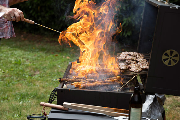 Food burning on a barbecue in summertime
